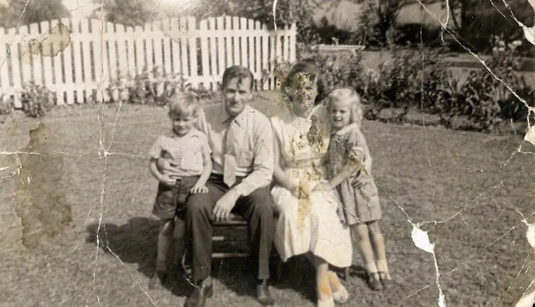 Damaged family photo before AI restoration